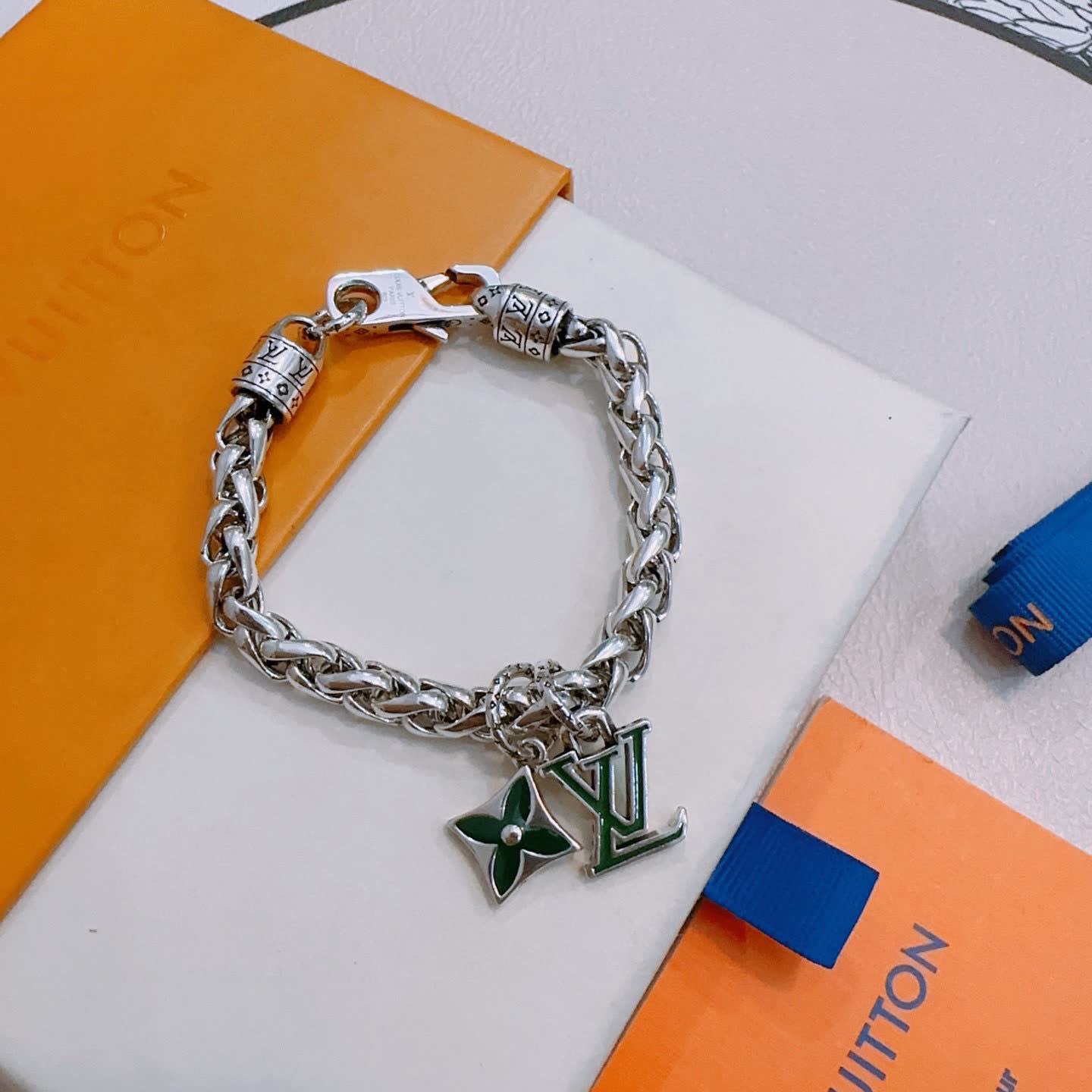 Louis Vuitton Silver Bracelet with LV Logo and Green Flower Charm